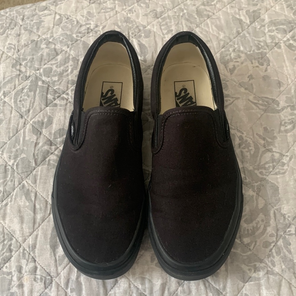 All black slip on Vans